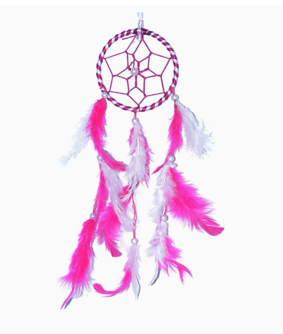 Dreamcatcher with a circular web design, decorated with pink and white feathers hanging from it.