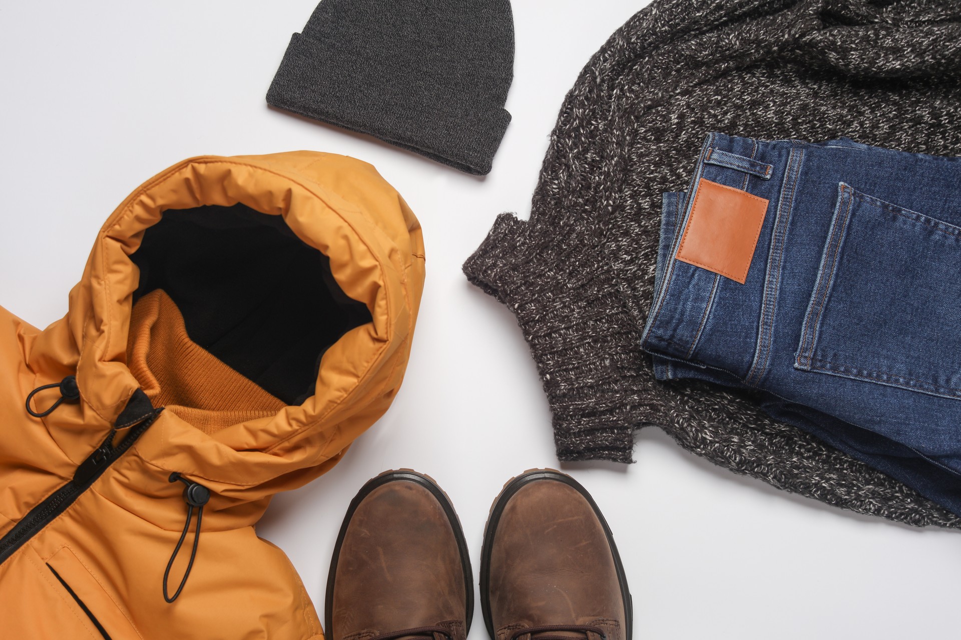 Set of men's winter clothes on a white background. Top view