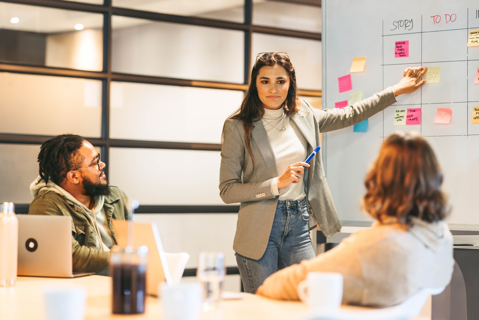 Scrum master engaging her business team in effective project management during a meeting